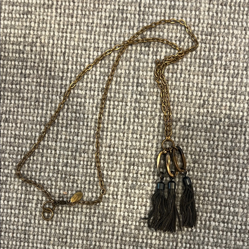 We Dream in Colour brass necklace with triple tassles. Approx 21” incl tassles.